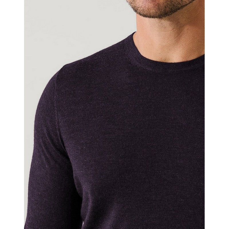 Man wearing a dark purple long-sleeve shirt against a light gray background