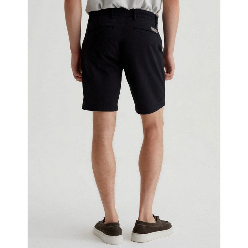 Person wearing black shorts on a white background