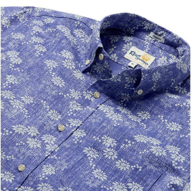 Blue floral patterned shirt with a brand label on a white background