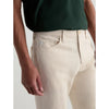 Beige pants worn by a person with a white background