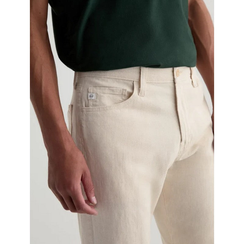 Beige pants worn by a person with a white background