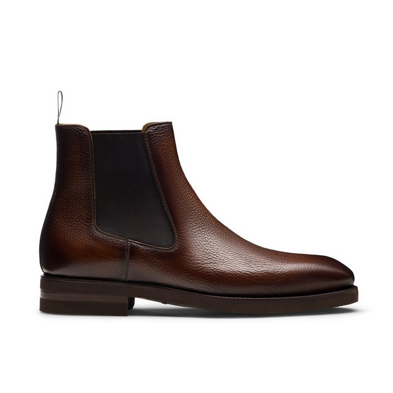 Brown leather Chelsea boot on a white background