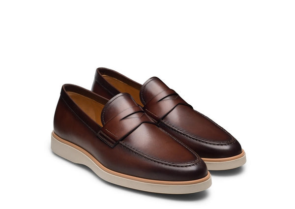 Pair of brown loafers on a white background