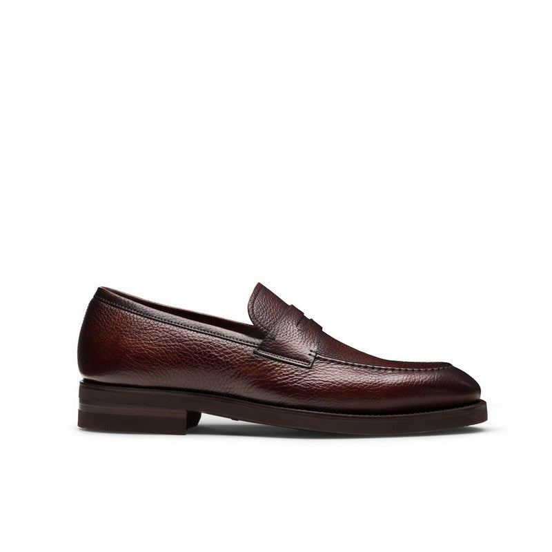 Brown leather loafer on a white background
