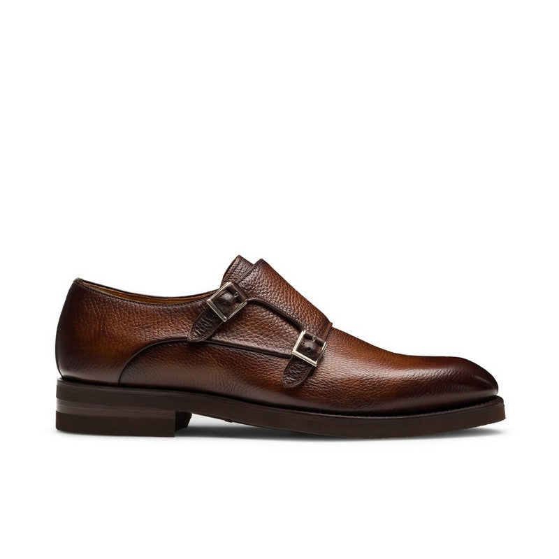 Brown leather monk strap shoe on a white background