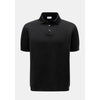 Black polo shirt on a white background