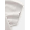 Grey polo shirt on a light gray background