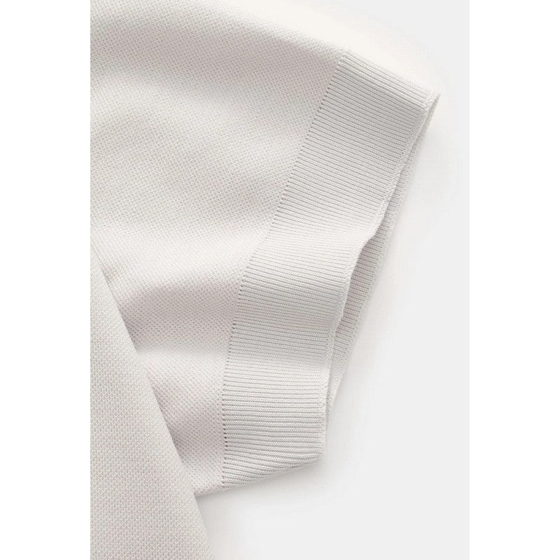 Grey polo shirt on a light gray background