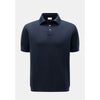 Navy blue polo shirt on a light gray background