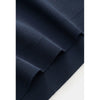 Close-up of a navy blue fabric texture on a white background
