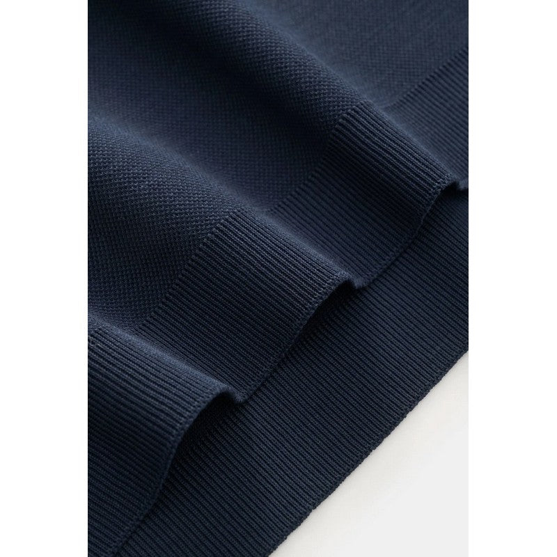 Close-up of a navy blue fabric texture on a white background