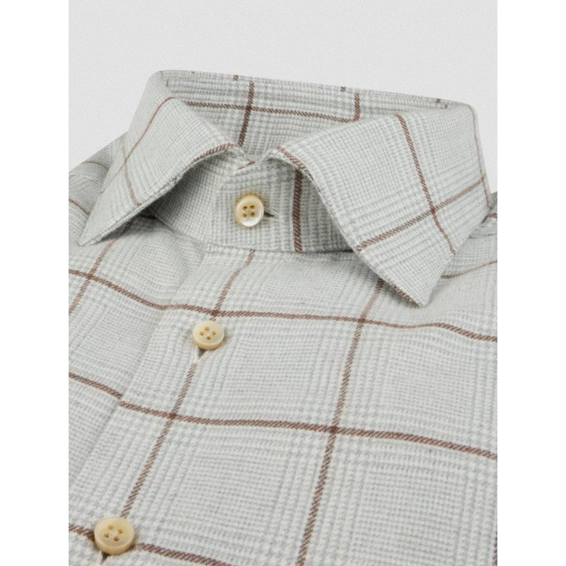 Close-up of a checkered shirt with button details on a white background