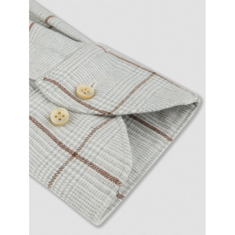 Folded fabric with plaid pattern and buttons on a light gray background