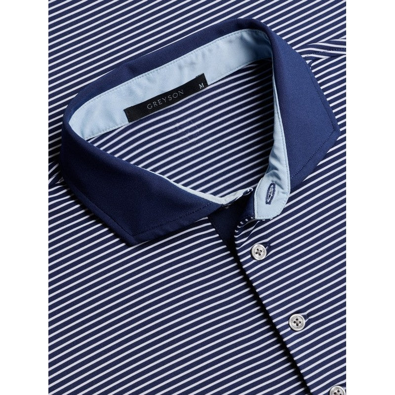 Close-up of a navy and white striped shirt with a branded collar tab.