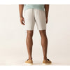 Person wearing light-colored shorts on a plain background