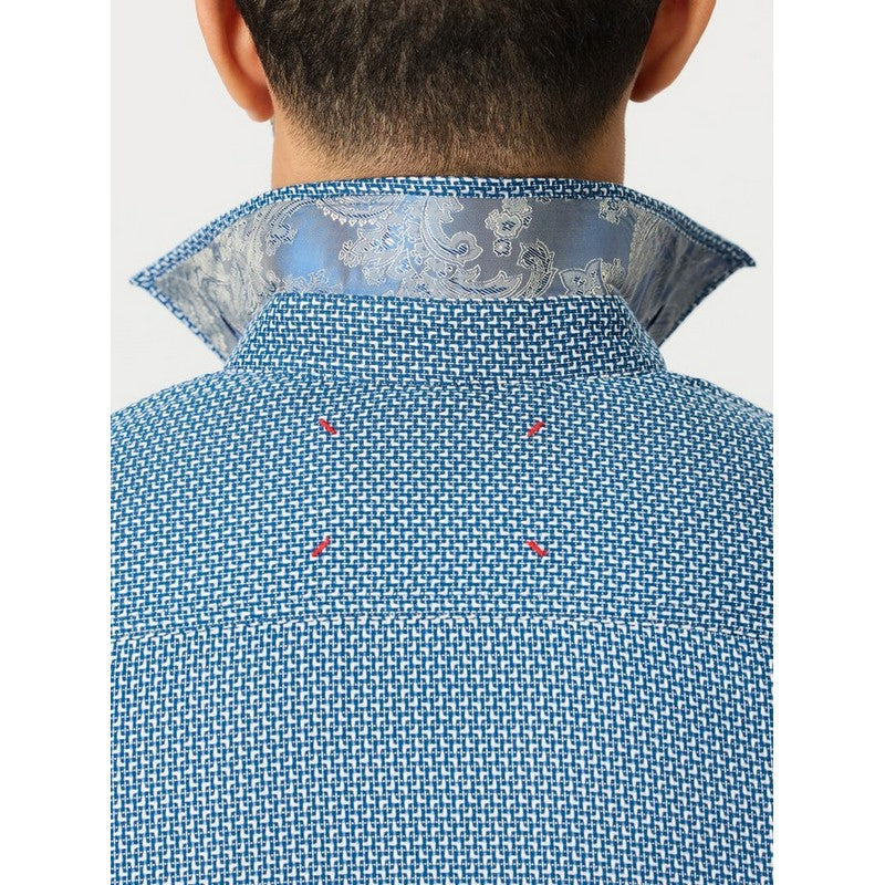 Close-up back view of a person wearing a blue patterned shirt with a light blue paisley inner collar lining, shown against a plain light background.