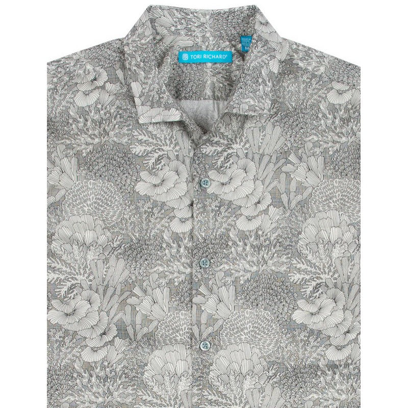 Floral patterned shirt with a brand label on a white background