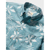 Blue floral patterned shirt with brand label on a white background