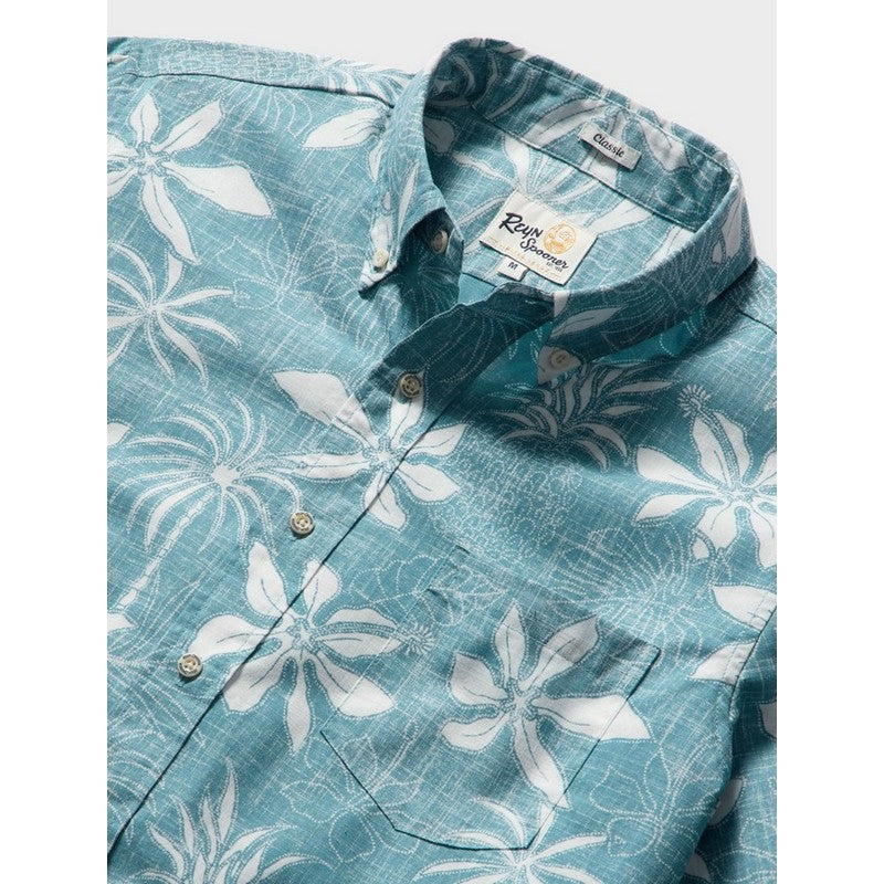 Blue floral patterned shirt with brand label on a white background