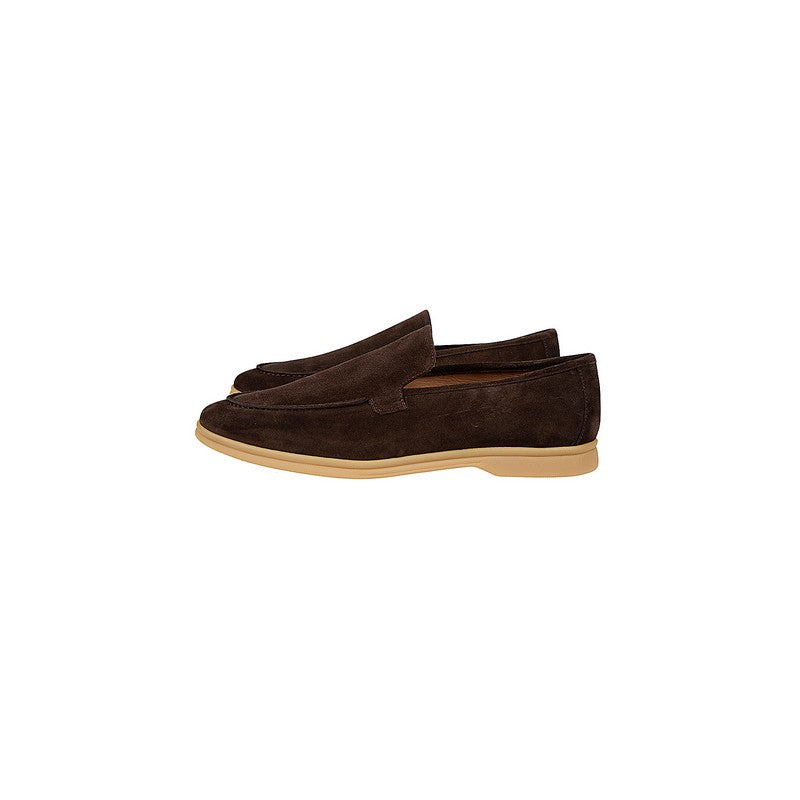 Pair of brown loafers on a white background