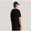 Person wearing a black t-shirt and cap on a light gray background