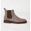Brown suede Chelsea boot on a light gray background
