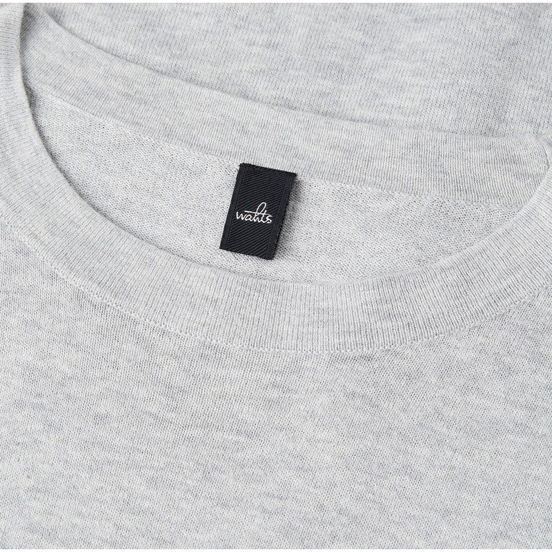 Gray t-shirt with a black label on the collar