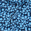 Close-up of a shirt with blue floral pattern on a navy background