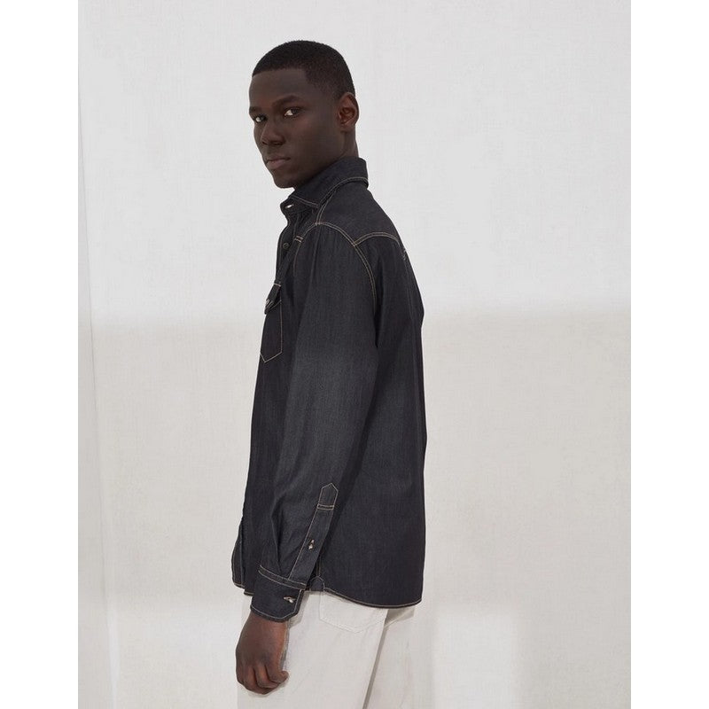 Man wearing a dark denim jacket on a white background