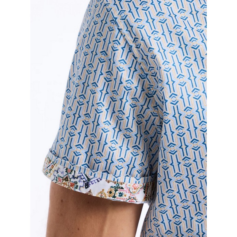 Close-up of a patterned shirt with geometric design on a white background