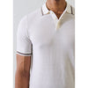 White polo shirt with brown trim on a plain background