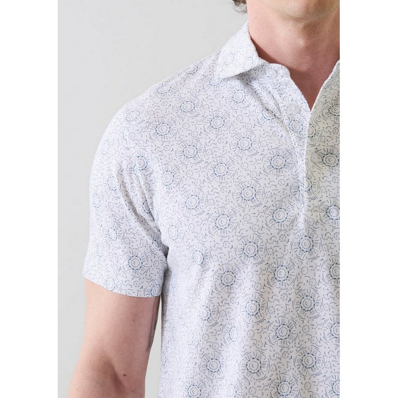 White patterned polo shirt worn by a person on a plain background
